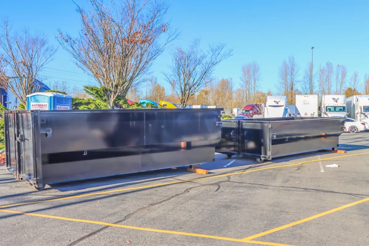 Professional dumpster rental service with roll-off container on residential driveway in Ridgefield Park village